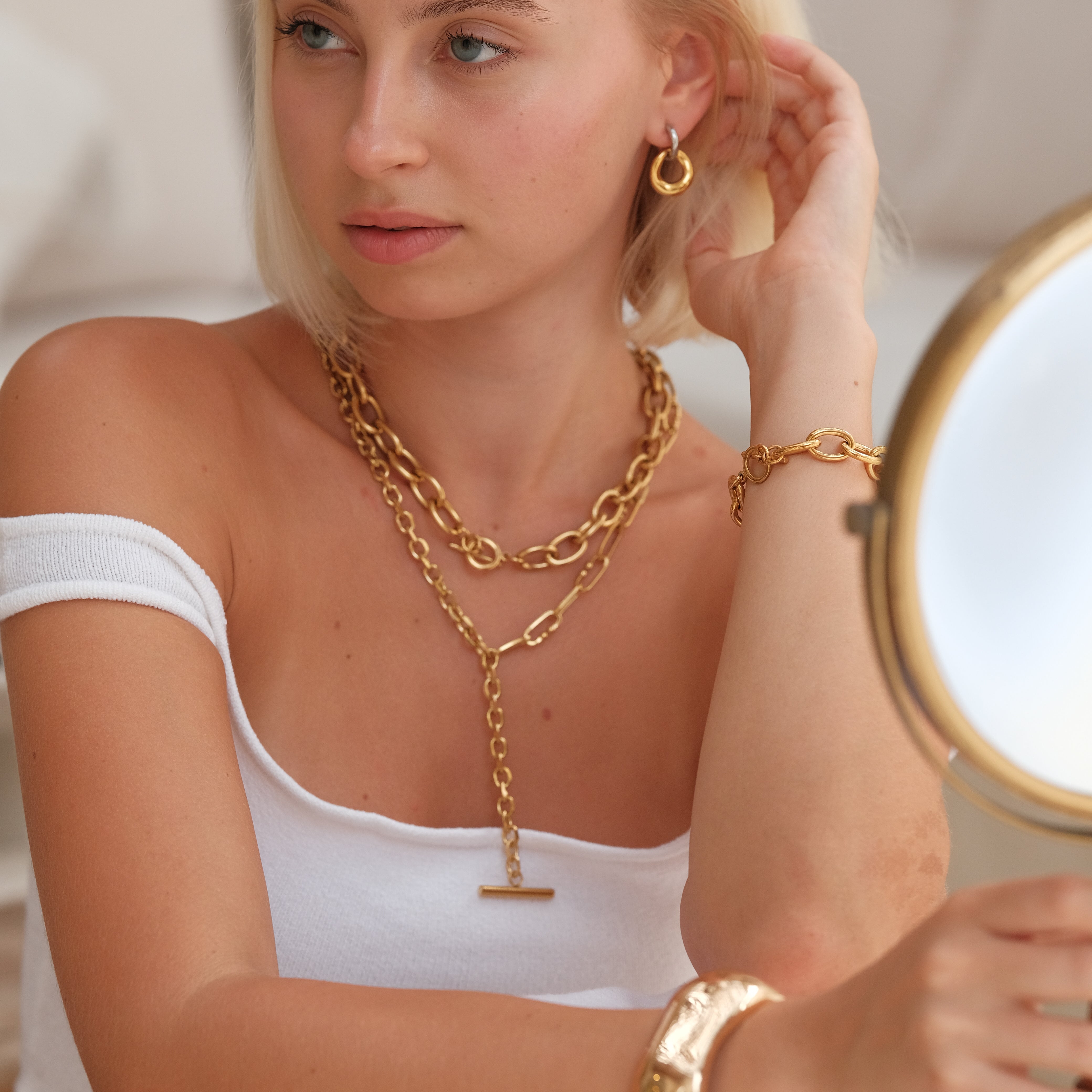 Emery Two-Tone Interlock Huggies by Lucy Luna Jewellery, alternate view 5